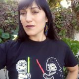 Woman wearing black shirt smiling.